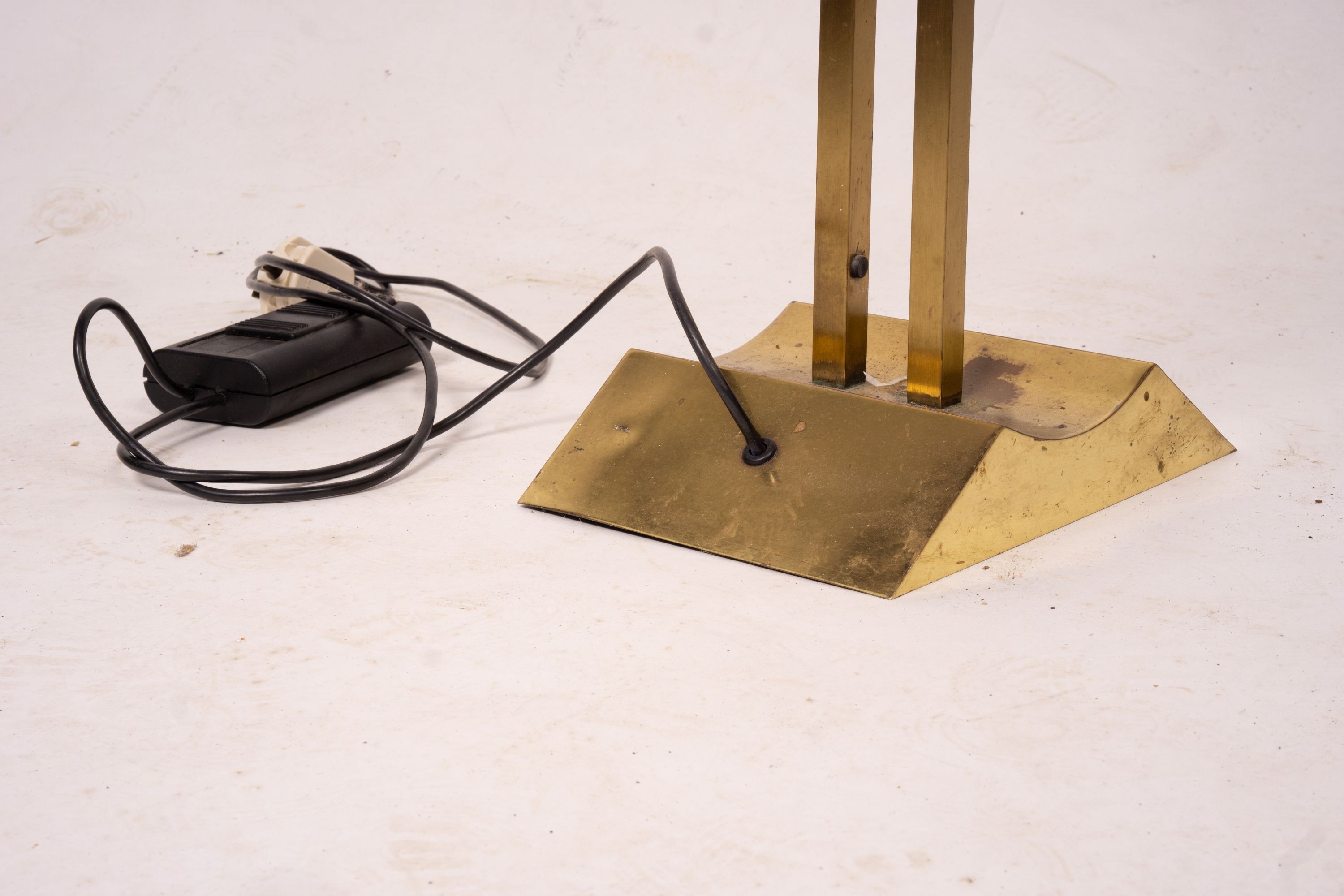 A contemporary brass uplighter floor lamp, height 180cm